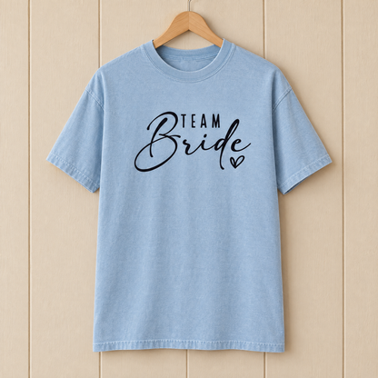 Team Bride shirt in Chambray Comfort Colors on a wooden hanger