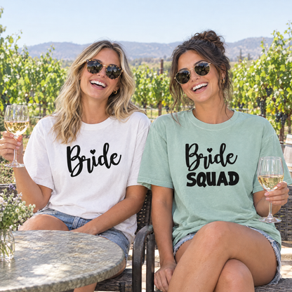 Bride in a White Bride shirt and best friend in a Seafoam Bride Squad shirt at a vineyard