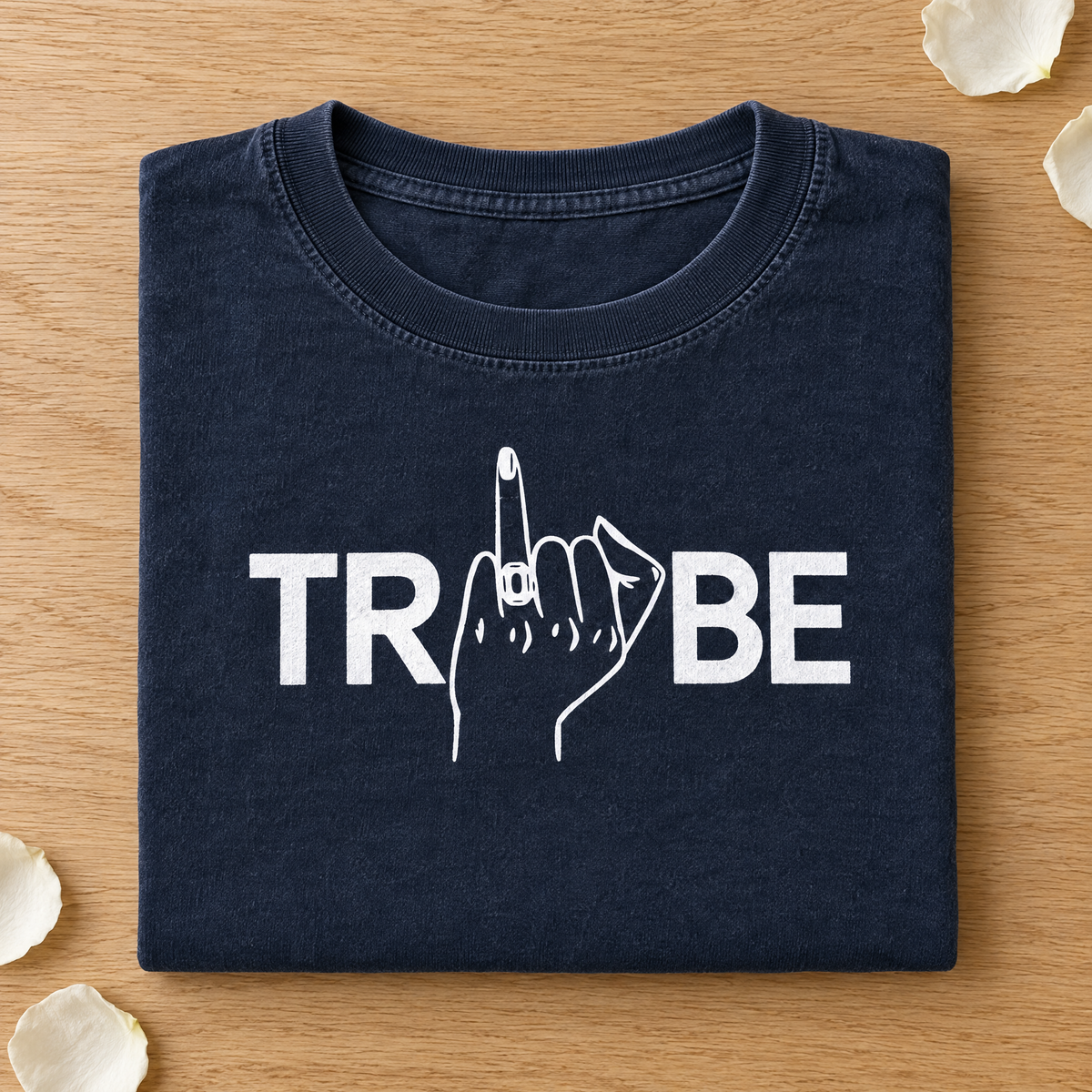 Tribe shirt in Midnight Comfort Colors with white print neatly folded