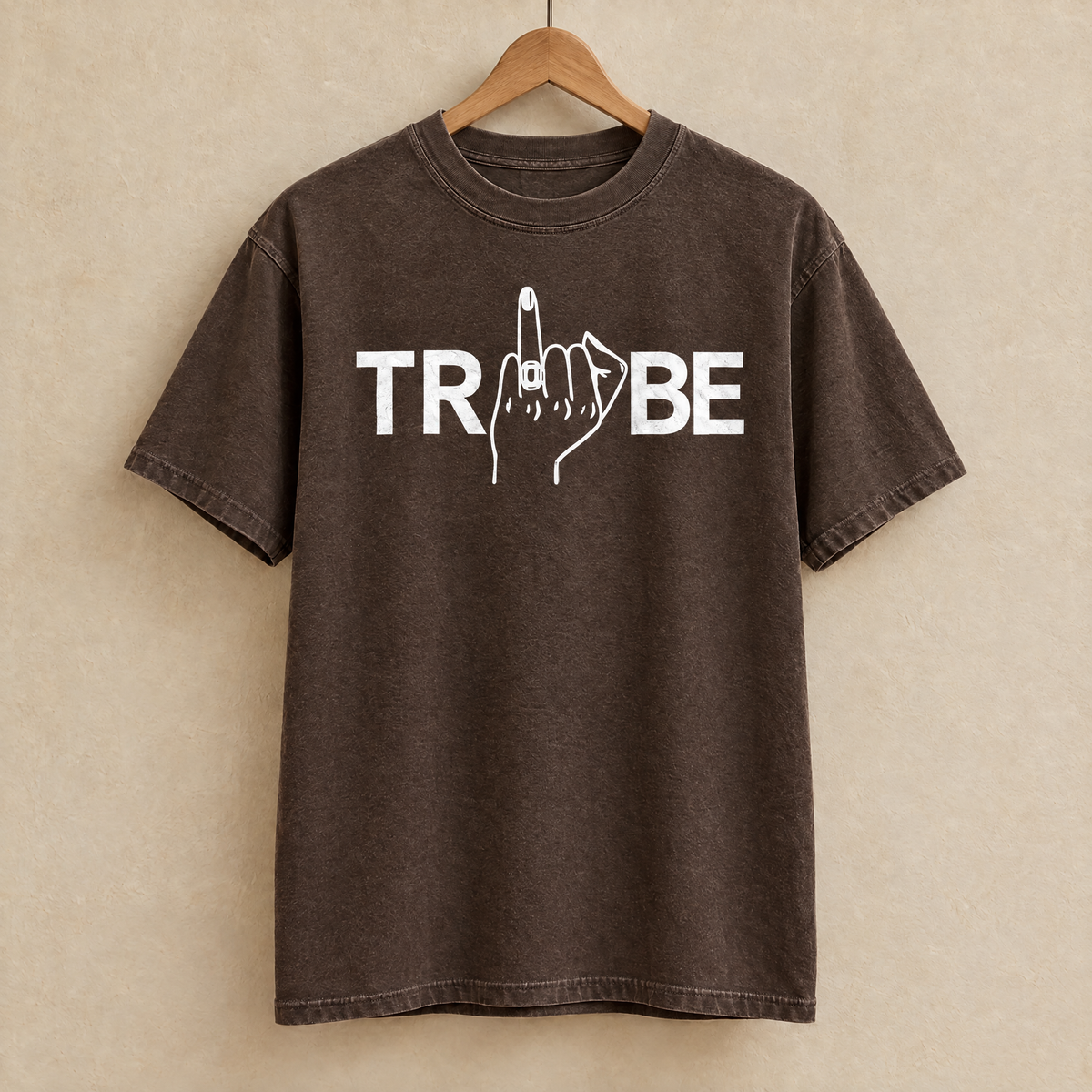 Tribe shirt in Espresso Comfort Colors on a wooden hanger