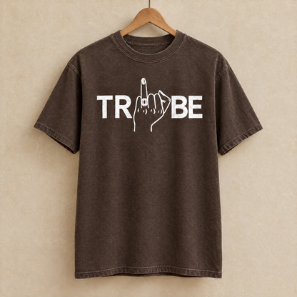 Tribe shirt in Espresso Comfort Colors on a wooden hanger