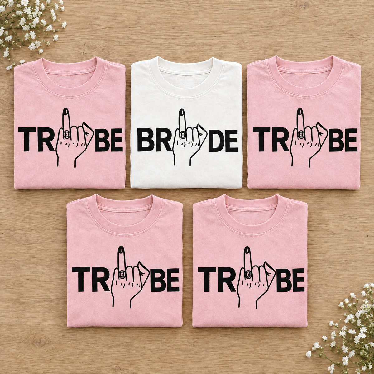Bachelorette party shirt set, White Bride tee with four Blossom Tribe tees neatly folded