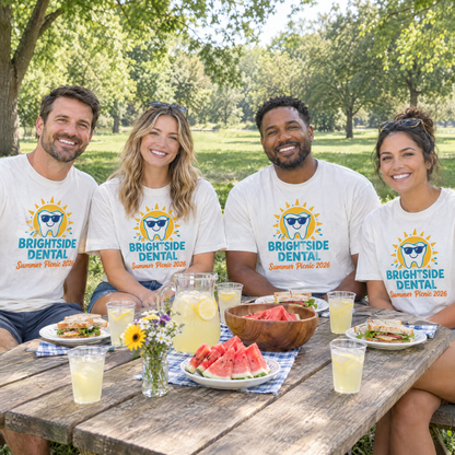 Coworkers at a company summer picnic in matching White custom logo shirts with a colorful Brightside Dental design