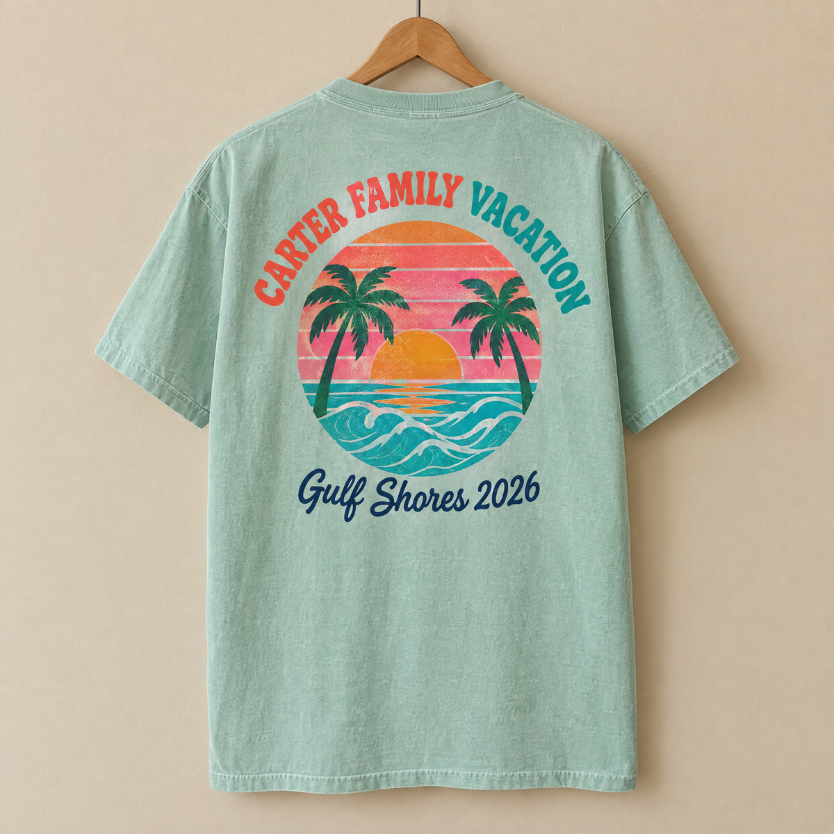 Custom back print shirt in Seafoam Comfort Colors with a colorful sunset Carter Family Vacation Gulf Shores 2026 design on a hanger