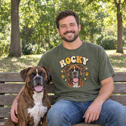Dog dad on a park bench with his boxer, wearing a Moss Comfort Colors shirt with a cartoon portrait of Rocky