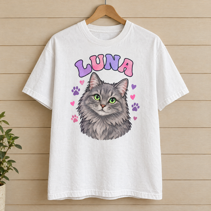 Custom cat portrait shirt in White Comfort Colors with a cartoon grey cat named Luna on a wooden hanger