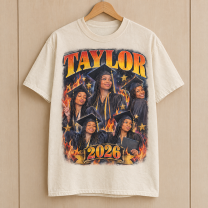 Graduation bootleg shirt in Natural Ivory Comfort Colors with a vintage fire photo collage of Taylor 2026 on a hanger