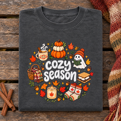 Cute fall Cozy Season tee in Pepper, folded with a knit scarf and cinnamon sticks