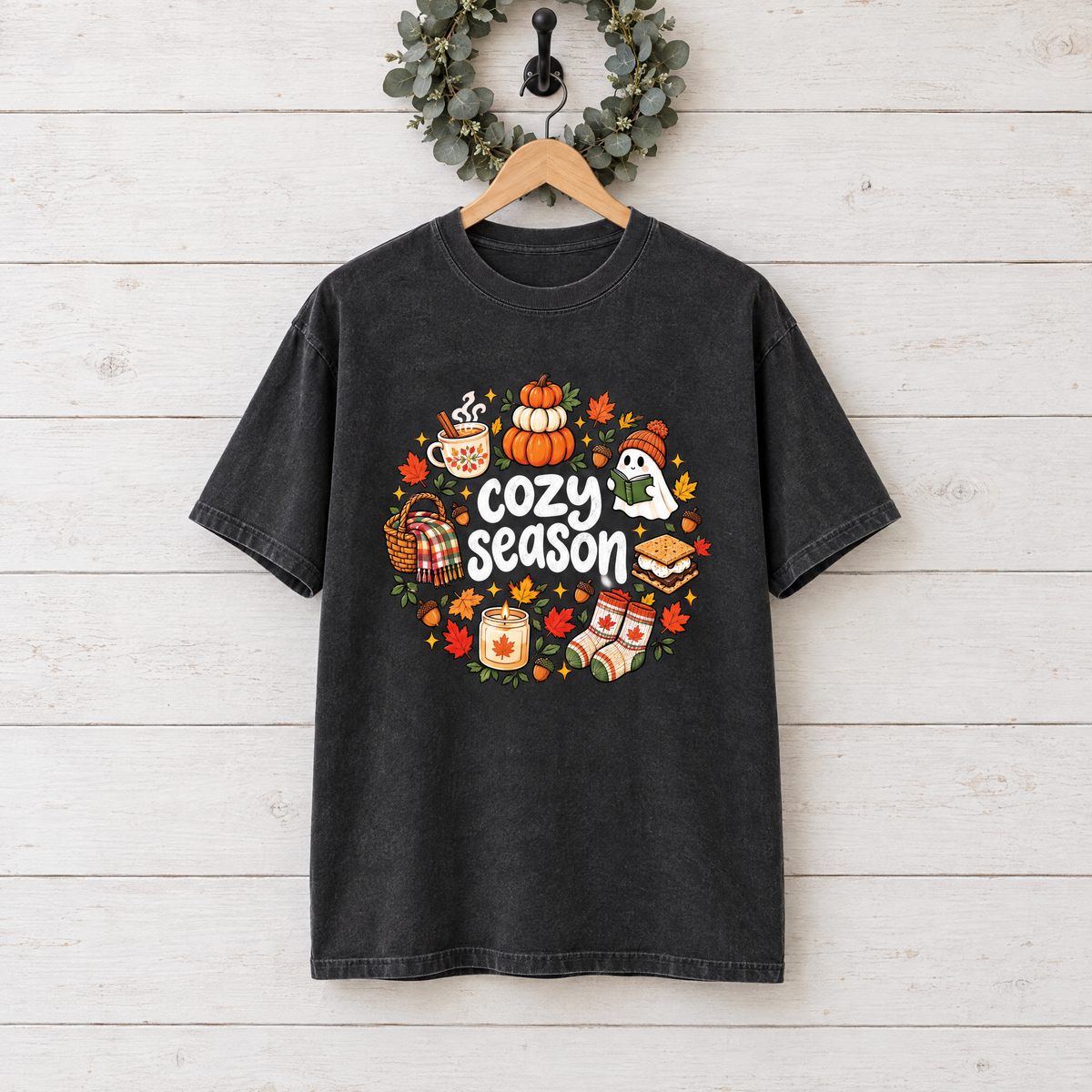 Cozy Season fall Comfort Colors shirt in Black on a wooden hanger