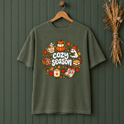 Cozy Season fall Comfort Colors shirt in Moss on a wooden hanger