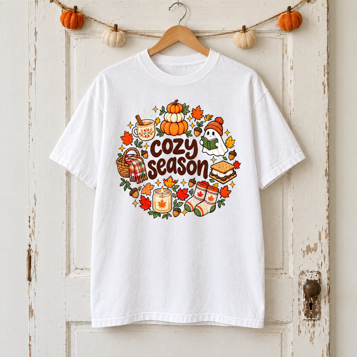 Cozy Season Comfort Colors shirt in White on a wooden hanger