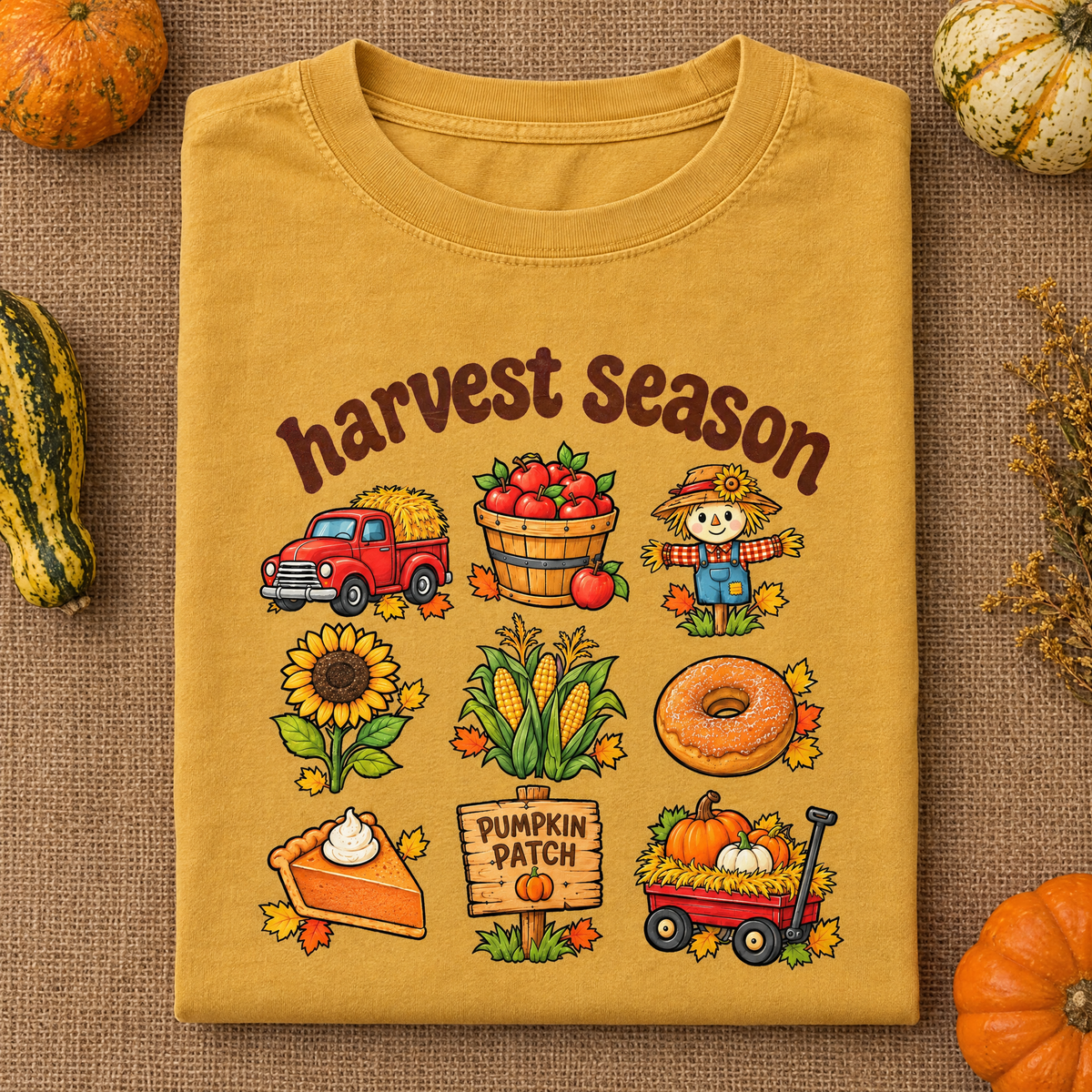 Pumpkin patch Harvest Season tee in Mustard, folded on burlap with gourds