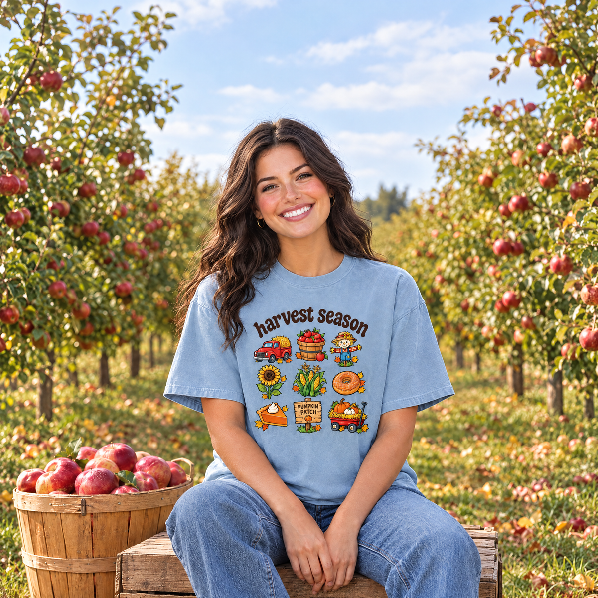 Woman wearing Chambray Comfort Colors Harvest Season shirt in an apple orchard