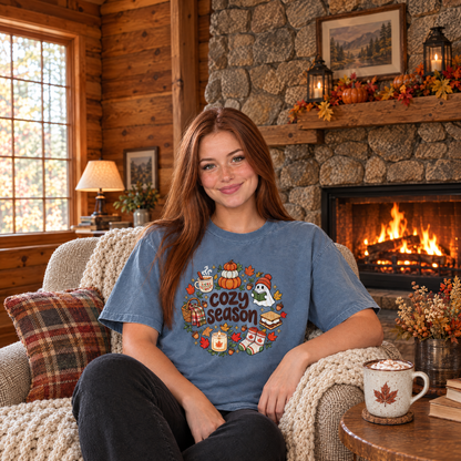 Woman wearing Blue Jean Comfort Colors Cozy Season shirt by a cabin fireplace