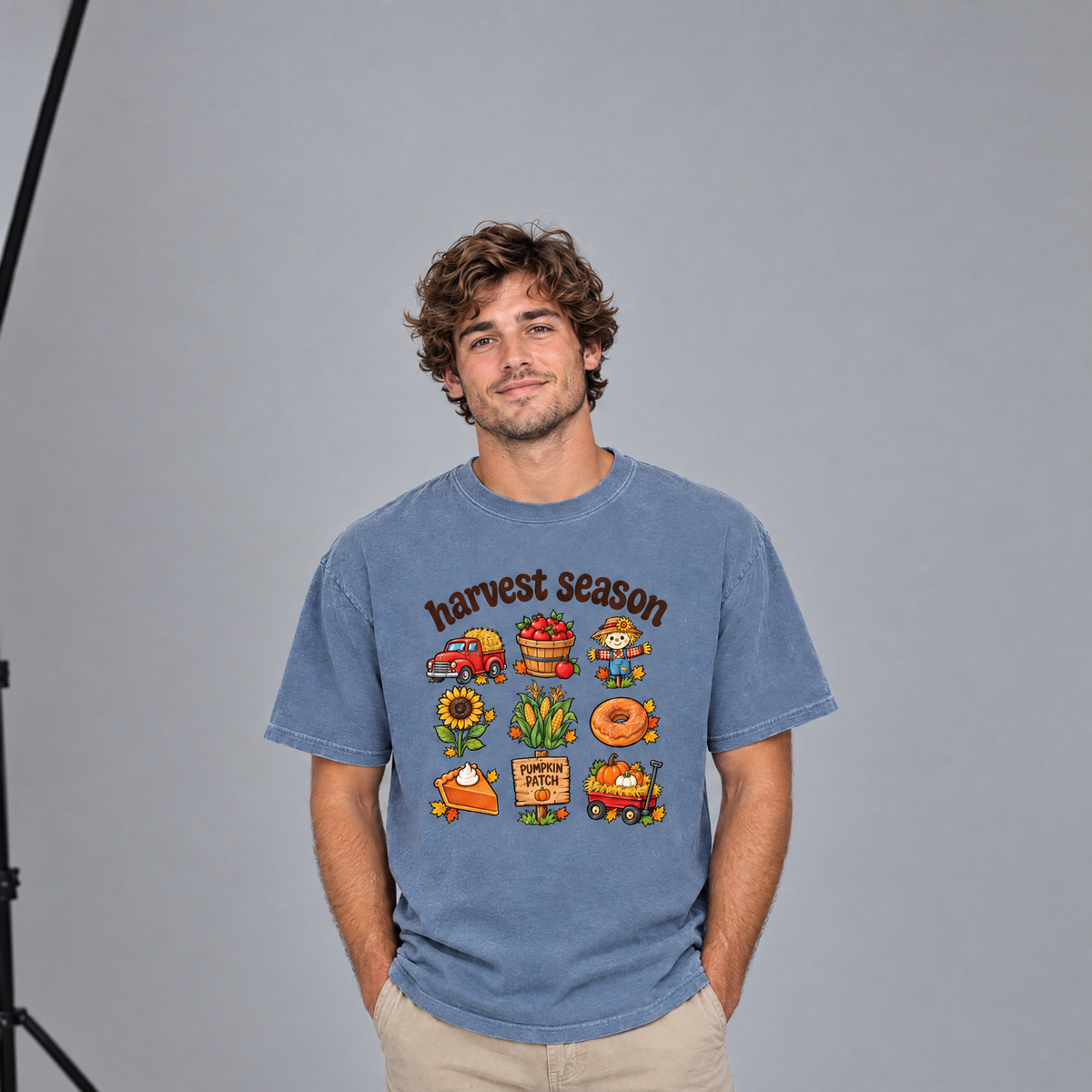 Man wearing Blue Jean Comfort Colors Harvest Season shirt in a photo studio