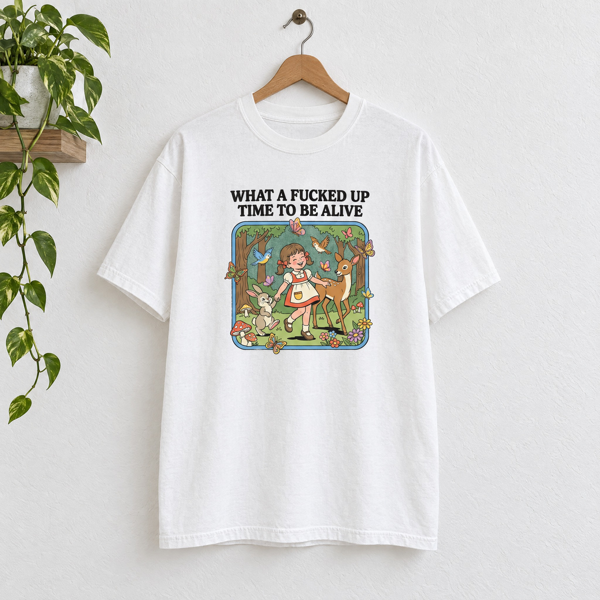 What a Time to Be Alive vintage storybook Comfort Colors shirt in White on a wooden hanger