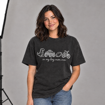 Woman wearing a Black boy mom era shirt with white line-art print in a photo studio