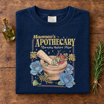 Kawaii anime apothecary tee in Navy, folded with a potion bottle and rosemary