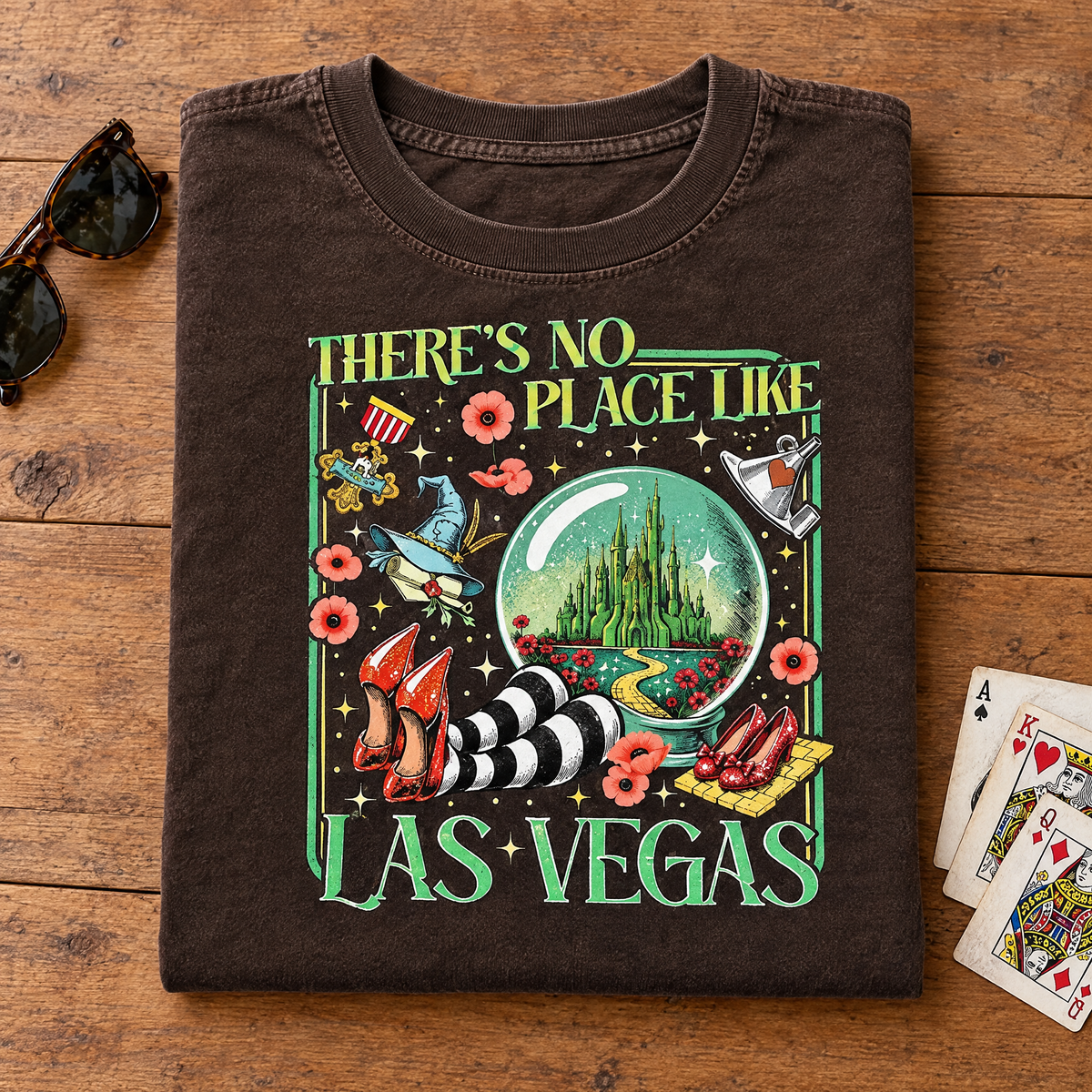 Las Vegas emerald city tee in Espresso, folded with sunglasses and playing cards