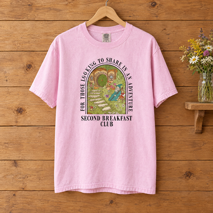 Second Breakfast Club Comfort Colors shirt in Blossom pink on a wooden hanger