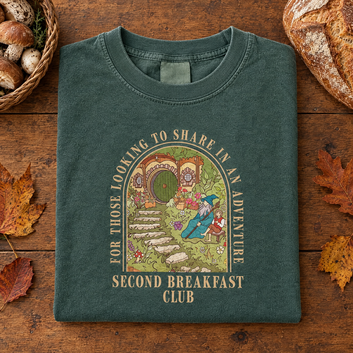 Second Breakfast Club cottagecore tee in Blue Spruce, folded with mushrooms and rustic bread