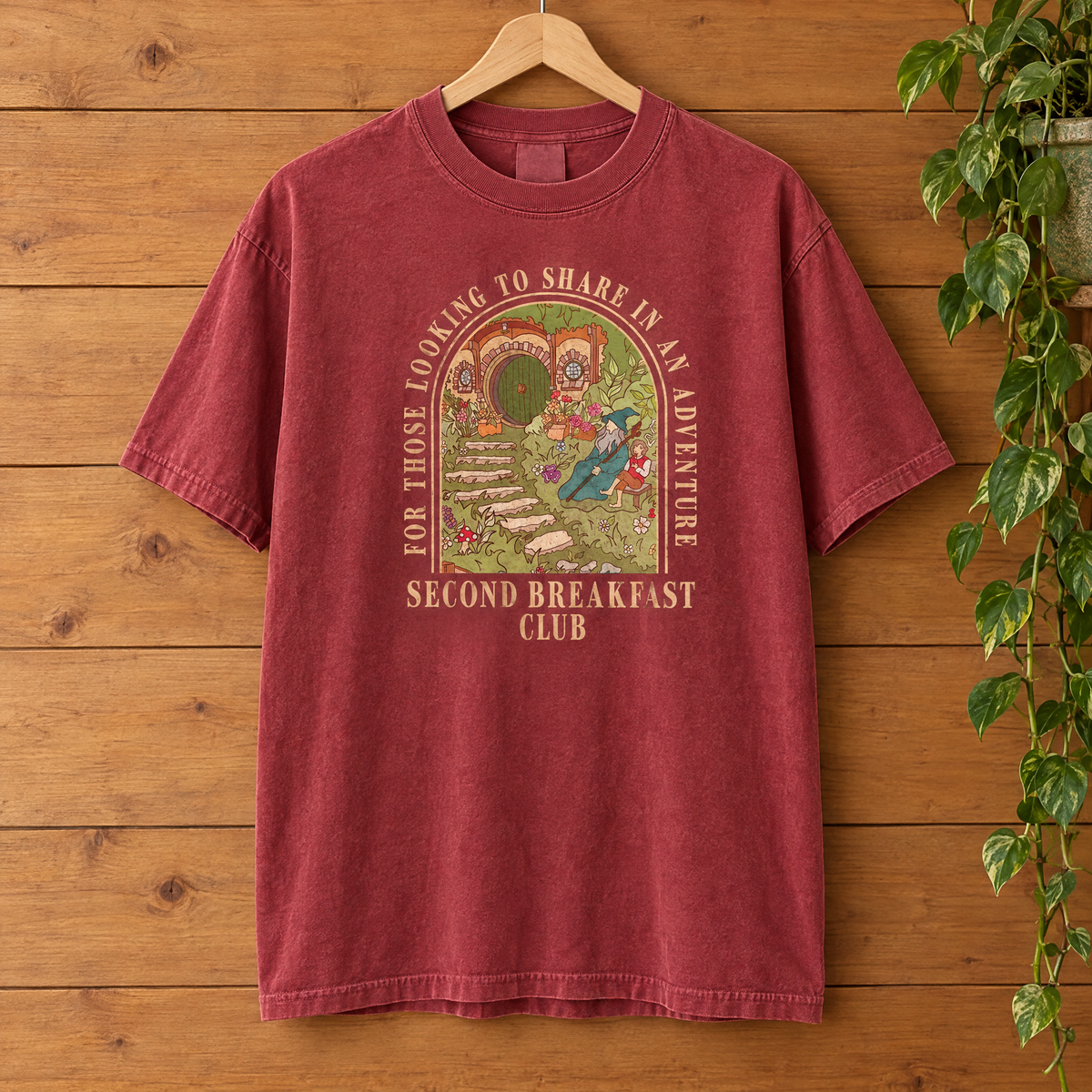Second Breakfast Club Comfort Colors shirt in Crimson on a wooden hanger