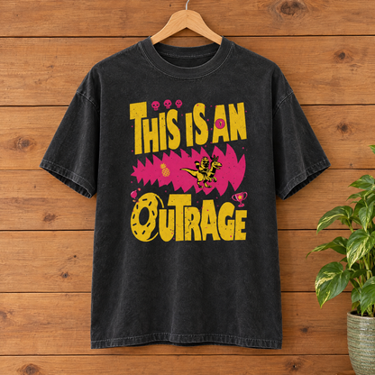 This Is An Outrage Comfort Colors shirt in Black on a wooden hanger