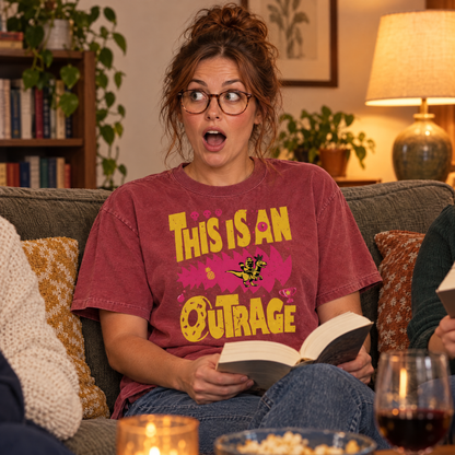 Woman wearing Crimson Comfort Colors This Is An Outrage shirt at book club making a shocked face