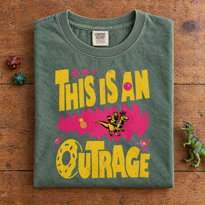 Funny bookish tee in Moss, folded with dice and a toy dinosaur