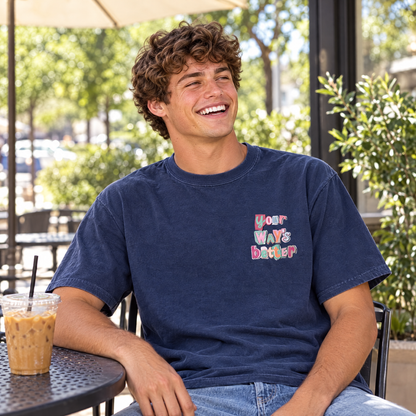 Man wearing Navy Comfort Colors Your Way's Better shirt at an outdoor coffee shop