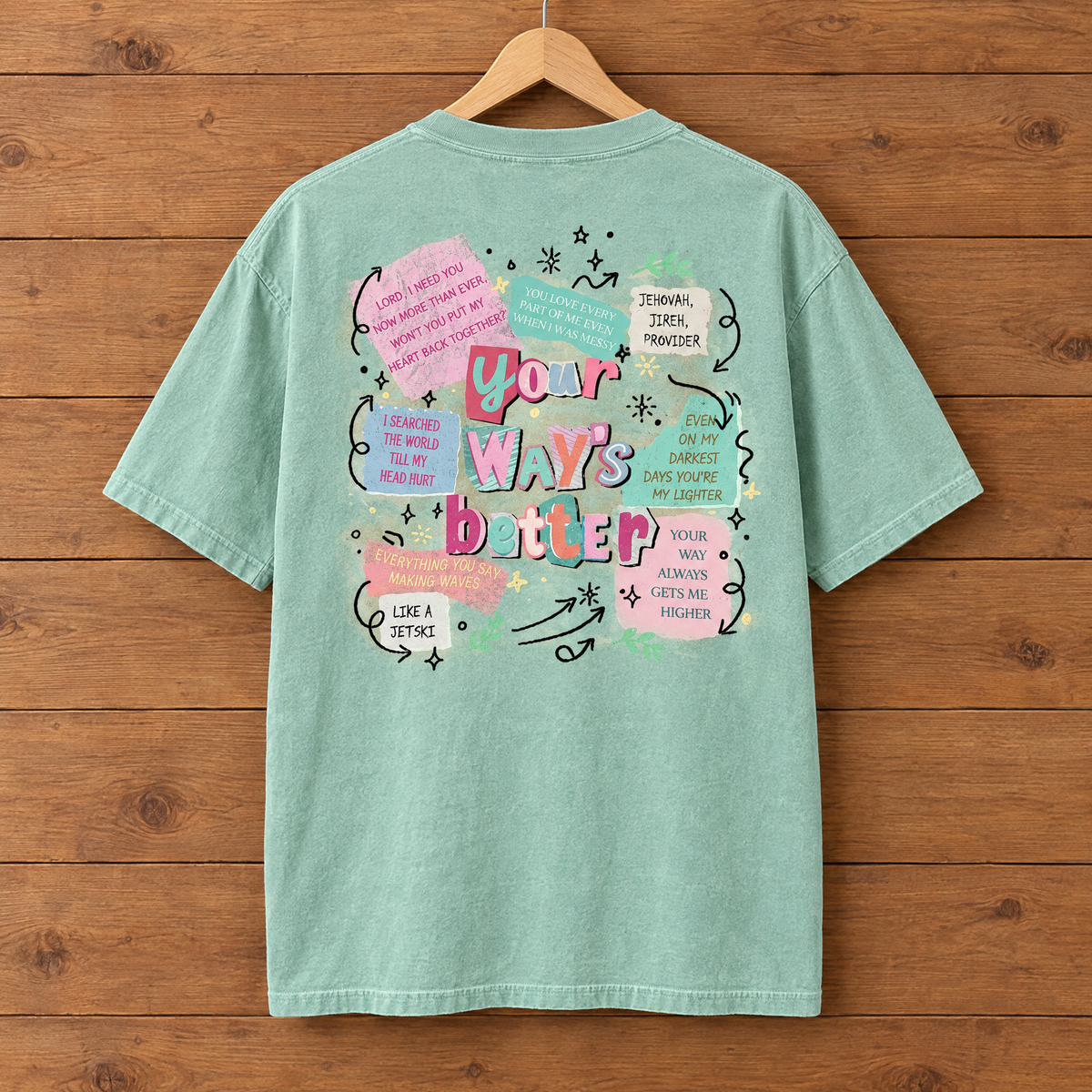 Back collage print of the Your Way's Better Comfort Colors shirt in Seafoam on a hanger
